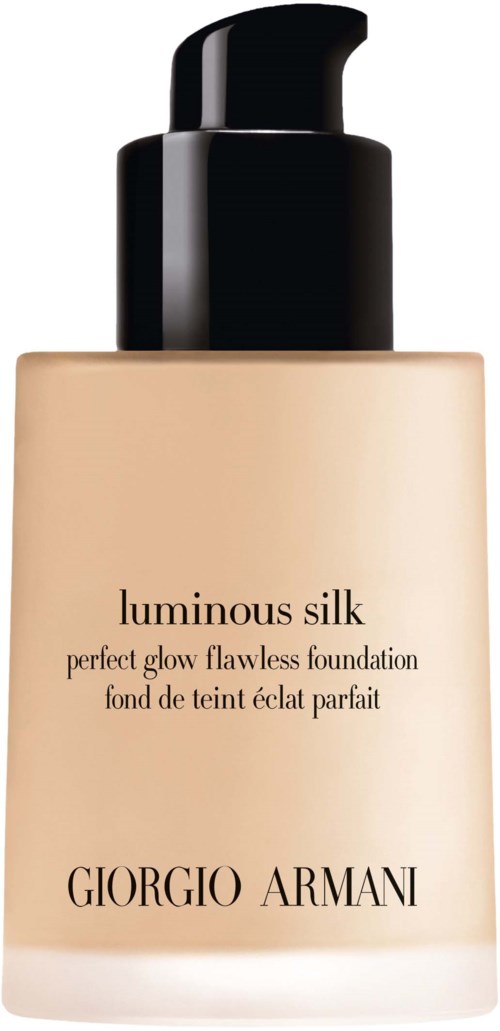 En beige foundationflaska med svart pump, märkt 'luminous silk' av Giorgio Armani, för glowing hud.
