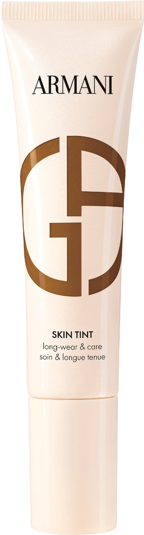 En vit tub med guld- och svart text, märkt Armani Skin Tint för långvarigt och vårdande.