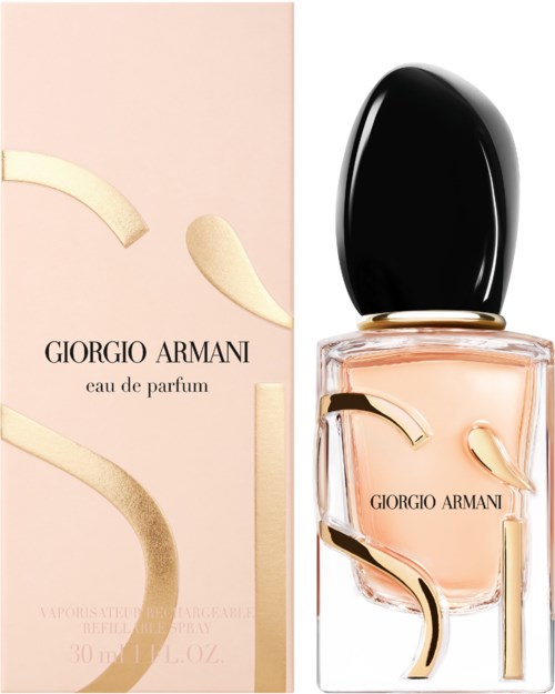 Ein Giorgio Armani Parfümflasche und Karton, beide mit abstrakten goldfarbenen Designs und weichem rosa Flüssigkeit.