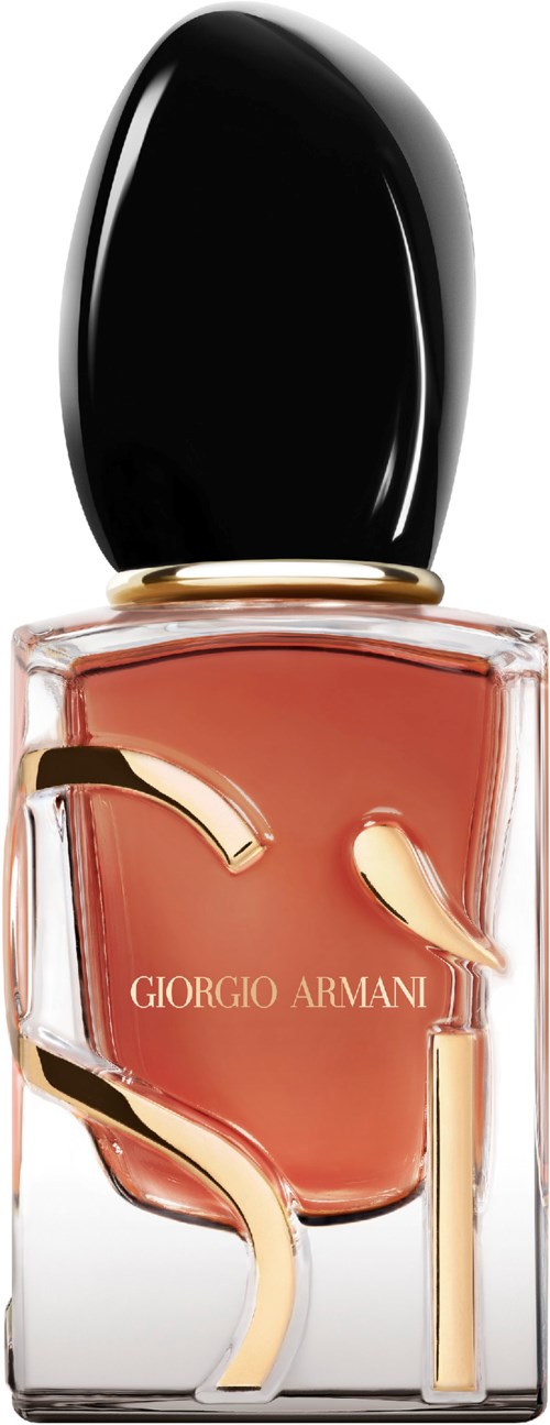 A nail polish bottle with a black cap, peach-colored polish, and gold 'S' shaped design on the front.