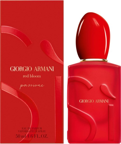 A red perfume bottle and box with Giorgio Armani branding and artistic design elements.
