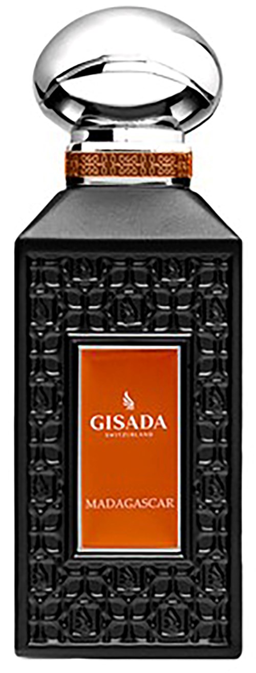 Een zwarte fles met decoratieve patronen, een oranje label en een glanzende, kapvormige dop.