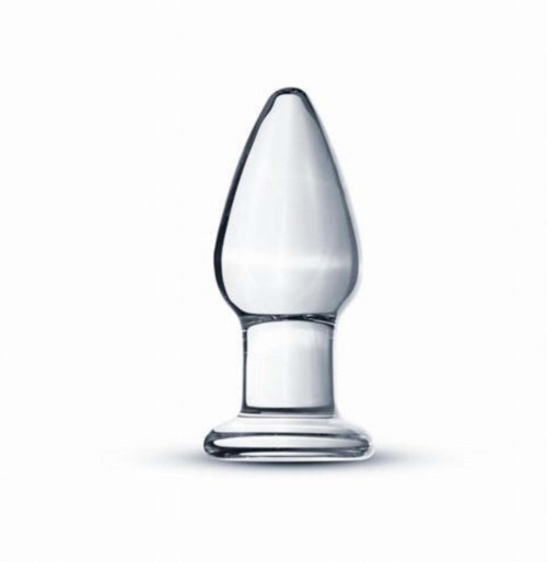 Ein glasartiges Objekt mit spitzer Spitze, ähnlich einer Pipette oder einem Behälter, steht auf einer Basis.