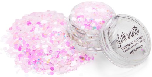 Container met roze en witte glitters, een deel eruit gevallen, gelabeld 'Glitternist COSMETIC GLITTER.'