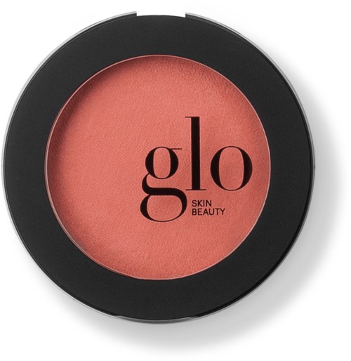 A round blush or eyeshadow makeup product with a black outer case and pinkish interior, branding says "glo skin beauty."
