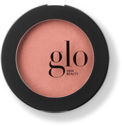 A round blush compact with a black rim, containing pink powder and the brand name "glo" printed inside.