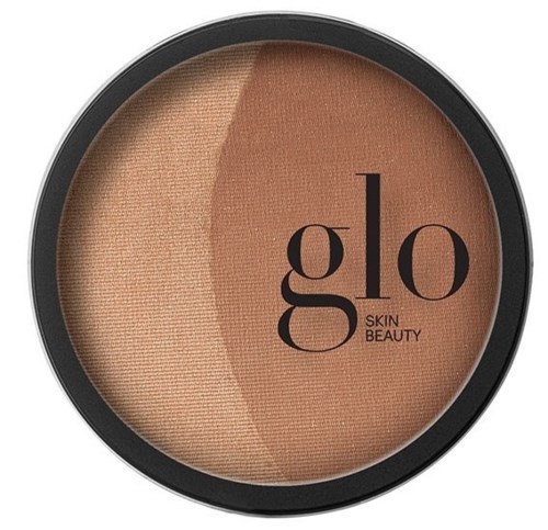 A compact with two shades of beige powder and the brand name Glo Skin Beauty on it.
