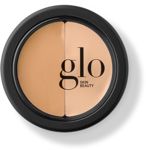 A compact face powder with two shades, labeled 'Glo Skin Beauty,' in a round black container.
