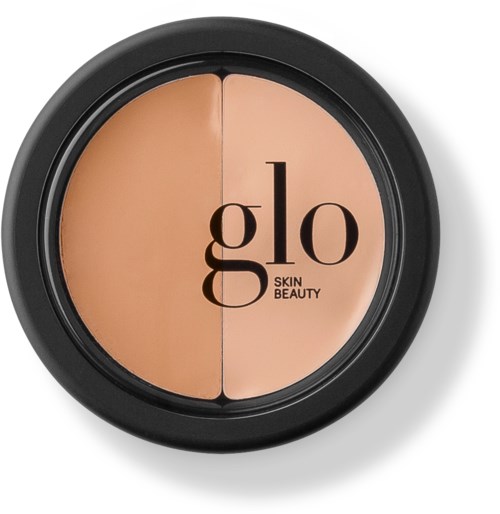 A black compact with two beige shades, labeled "glo SKIN BEAUTY" and divided in the middle.