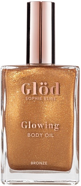 A bronze-colored body oil in a clear bottle with a shiny silver cap, labeled 'Glöd' by Sophie Elise, for glowing skin.