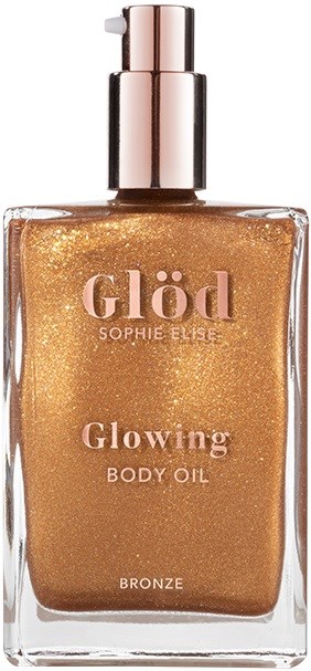 A shiny bronze body oil in a clear glass bottle with a pump, labeled 'Glöd Sophie Elise, Glowing Body Oil, Bronze.'