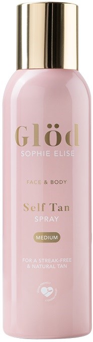 A pink spray bottle with gold cap, labeled 'Glöd' for face and body tanning, medium level.