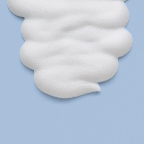 A swirl of white foam on a light blue background.