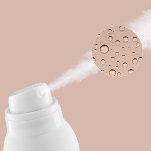 A white spray can releases a mist, with a bubble pattern depicted on a beige background.