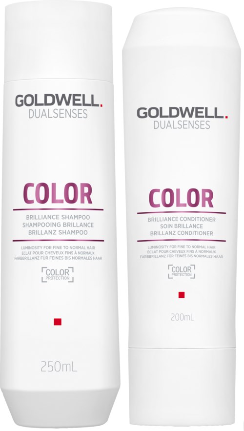 Kaksi valkoista pulloa, toinen shampoo ja toinen hoitoaine, Goldwellilta, merkitty värin kiiltoon.