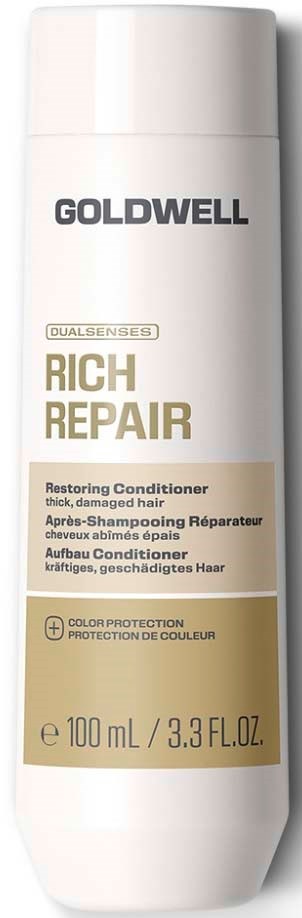 En hvit flaske med Goldwell Rich Repair hårbalsam med beige og gull etikett.