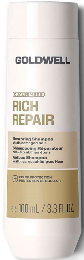 En hvit flaske med Goldwell Rich Repair Restoring Shampoo for tykt, skadet hår med gullfarget og svart tekst.