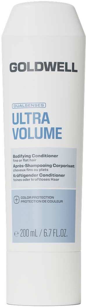Hvit flaske med Goldwell Ultra Volume balsam med blå etikett, som viser produktnavn og størrelse.