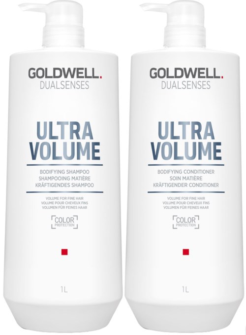 Kaksi valkoista Goldwell Ultra Volume -tuotepulloa, shampoota ja hoitoainetta, joissa pumput.