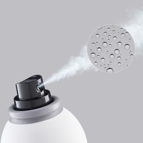 A humidifier releases mist, with water droplets shown in a magnified circle, against a gray background.