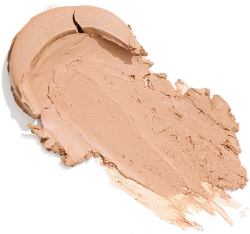 Een ronde, beigekleurige compact met gespreide crème foundation.