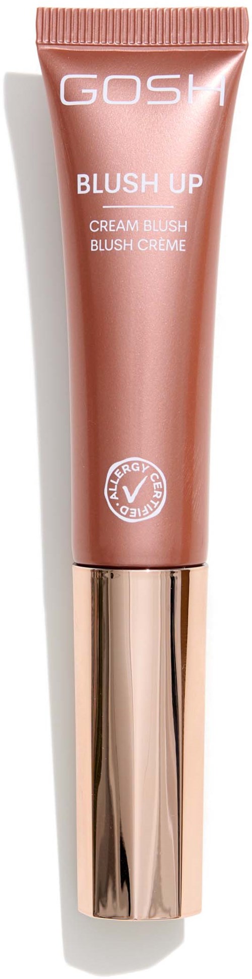 Een tube GOSH Blush Up Cream Blush in perzikkleur met een glanzende gouden dop.