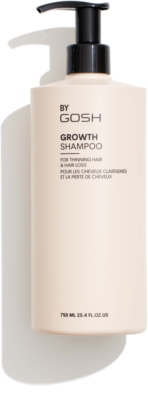 Een eenvoudige witte shampoo fles met zwarte pomp, met label "BY GOSH GROWTH SHAMPOO".
