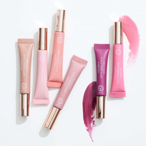Sammlung von Lippenprodukten in rosa und lila Röhren mit glänzenden Deckeln, einige mit verschmierter Lippenfarbe.