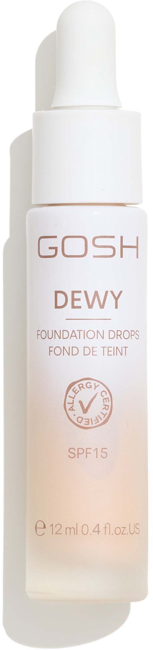Een witte fles met pipet, labeled GOSH Dewy Foundation Drops, SPF 15, 12 ml.