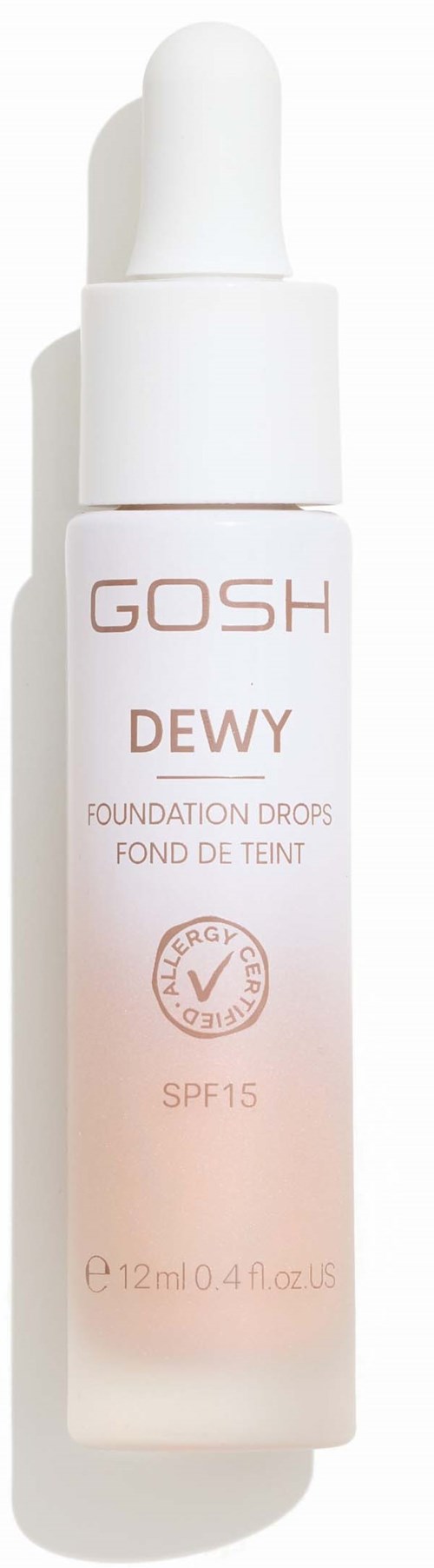Eine weiße Flasche mit Tropferkappe, beschriftet 'GOSH DEWY' Foundation Drops mit SPF 15.