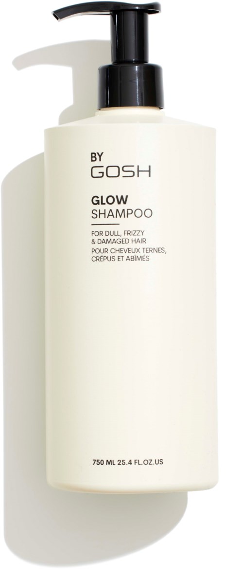 Een wit shampoefles met een zwarte pomp, gemerkt 'BY GOSH GLOW SHAMPOO' voor dof, kroes, beschadigd haar.
