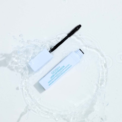 A white tube labeled GOSH with a black wand inside, placed in water with ripples around it.
