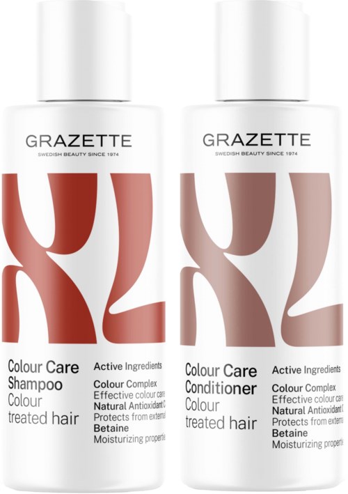 Twee witte flessen met rode en grijze abstracte ontwerpen, gemarkeerd Grazette, voor shampoo en conditioner.