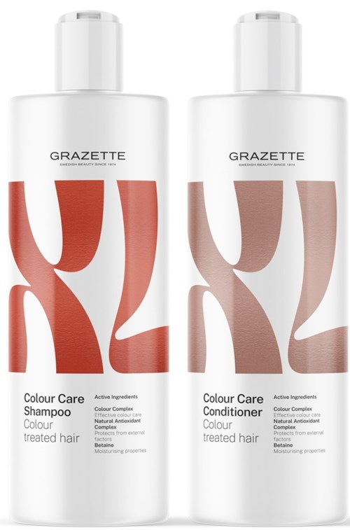 Two white bottles of hair care products, one shampoo and one conditioner, with abstract red and brown design. 