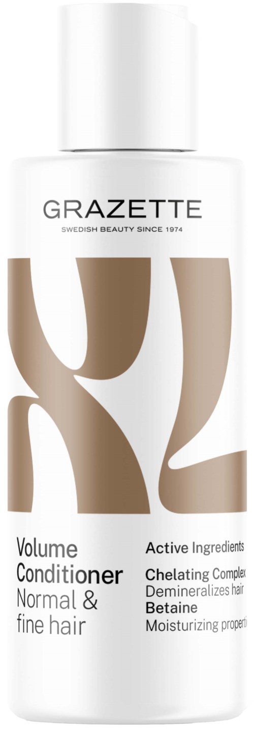 Een witte fles met het label Grazette, met bruine abstracte ontwerpen, zegt dat het een volumeverzorging voor normaal en fijn haar is.