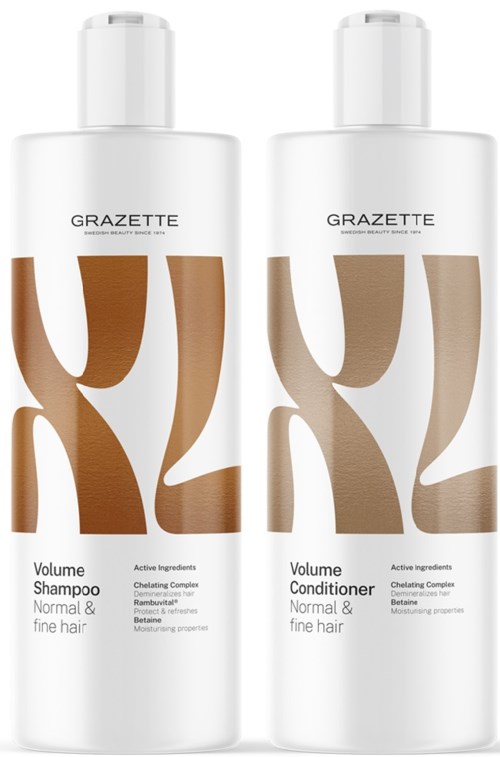 Two white bottles, one labeled Volume Shampoo and the other Volume Conditioner, for normal and fine hair.