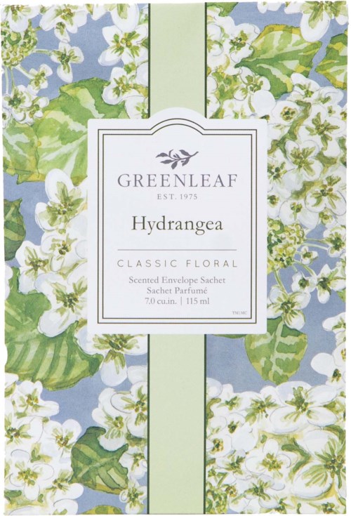 Decorative packaging with white flowers, green leaves, and light blue background. Text on label about floral scent perfume.
