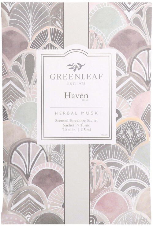 A decorative package with pastel-colored leaf patterns and a white label. It says 'Greenleaf Haven Herbal Musk' and other details.