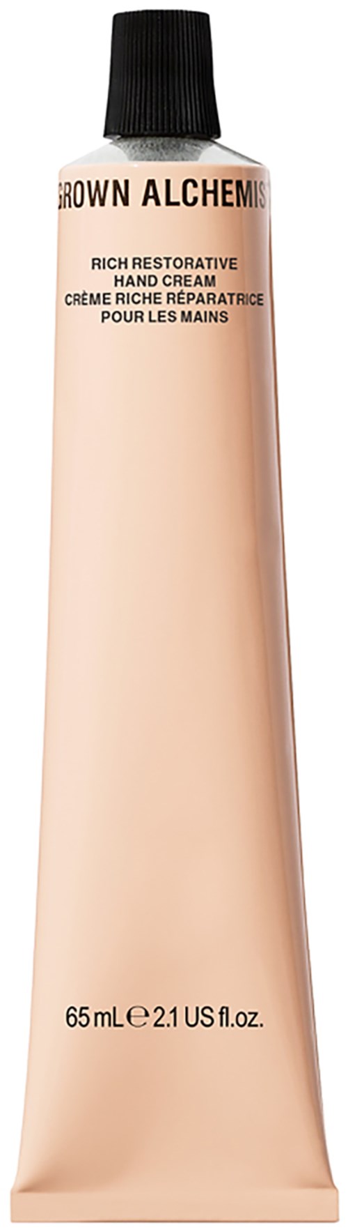 Een tube handcrème met een zwart deksel, gemerkt Brown Alchemy, bevat 65 ml rijke herstellende crème.