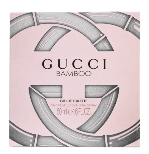 Gucci bambukparfymask med grå logga och rosa bakgrund.