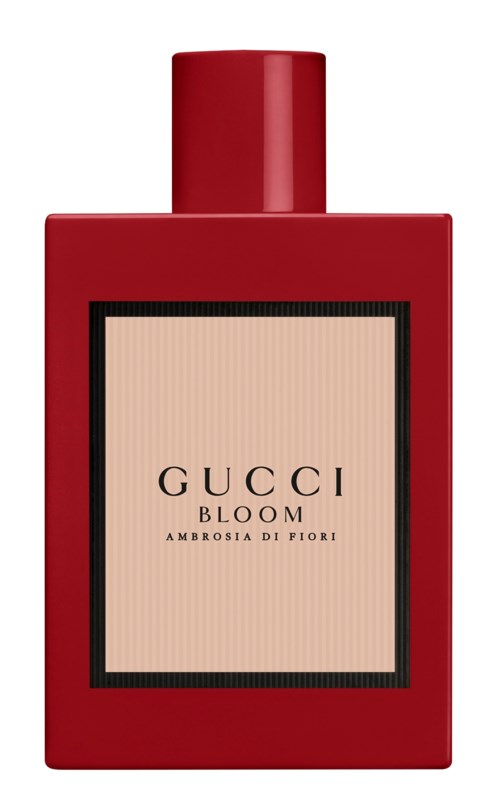 En röd flaska med Gucci Bloom-parfym, rektangulär form och enkel etikett.