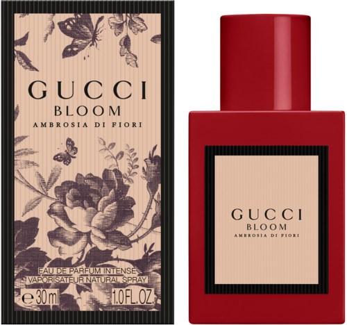 Een rode parfumfles en een bloemmotief doosje, beide gelabeld 'GUCCI BLOOM Ambrosia di Fiori'.