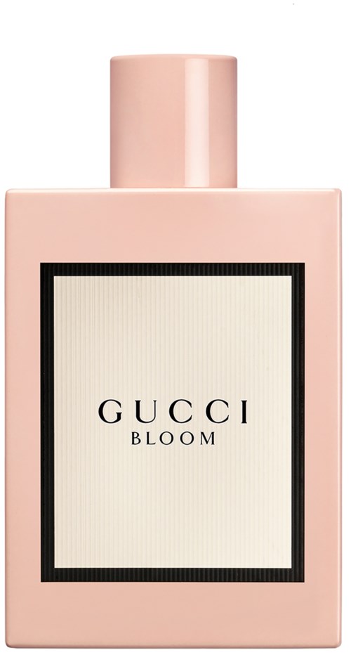 Een roze parfumfles met een witte label met 'GUCCI BLOOM'.