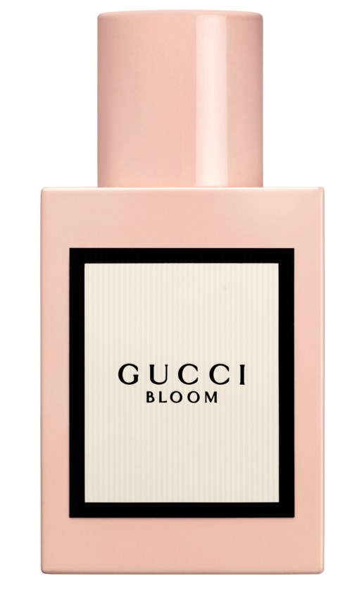 En rosa flaska med en svartomsluten etikett som säger 'GUCCI BLOOM'.