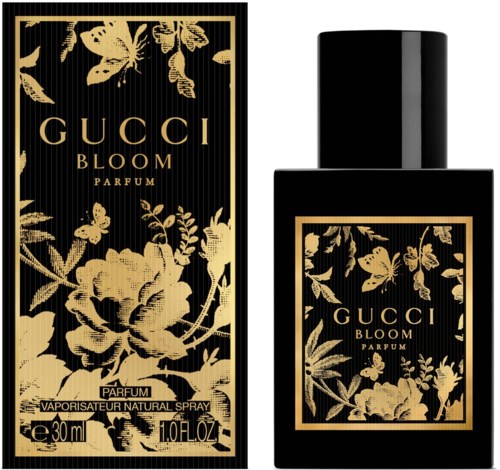 Een zwart en goud bloemenontwerp op parfumverpakking en fles, met de merknaam 'Gucci Bloom'.