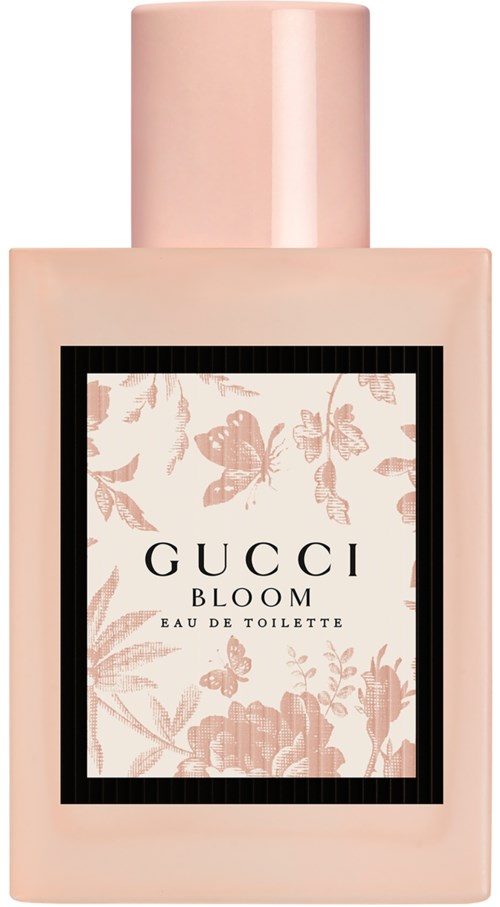 Een roze parfumfles met bloemendessin en de woorden "GUCCI BLOOM".