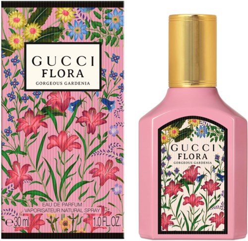 Bloemige parfumfles en doos met roze, gele, paarse en blauwe bloemen en groene bladeren.