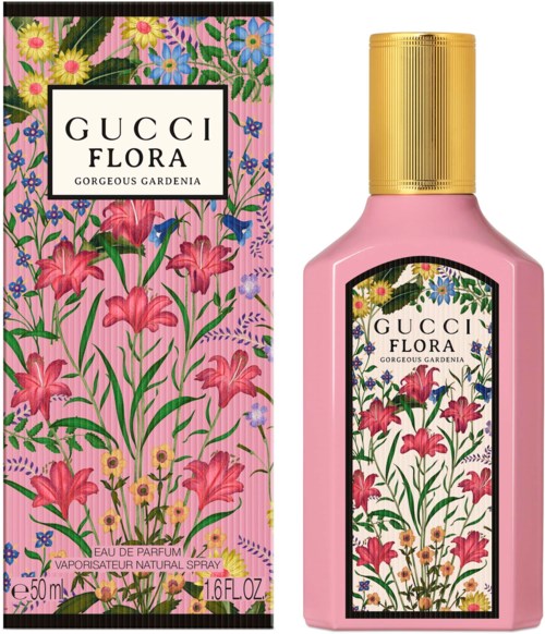 Een roze fles en doos met bloemendesign, labels zeggen 'Gucci Flora Gorgeous Gardenia.'