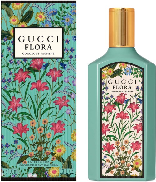 Een parfumfles en doos met een bloemenpatroon met roze, gele, blauwe en groene bloemen en bladeren.