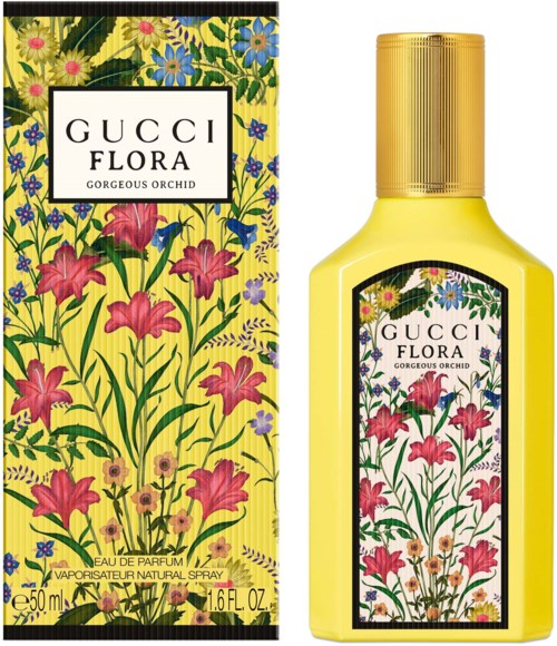 Gele fles met een bloemenlabel en een kleurrijk bloem- en vlinderontwerp. Doos heeft ook een bijpassend bloemenpatroon.